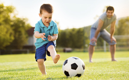 Child Playing Soccer
